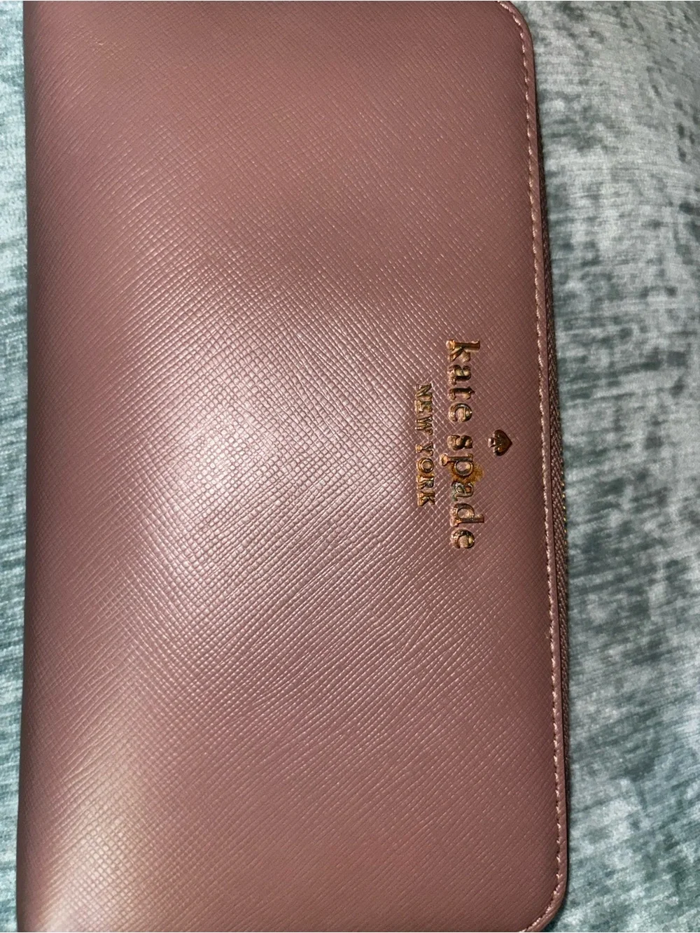 kate spade mauve zip-around wristlet with gold logo
